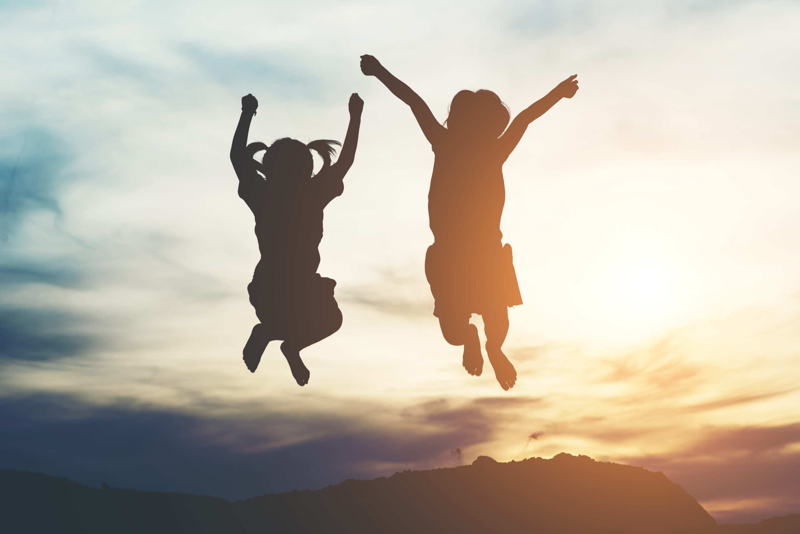 silhouette two girl having fun nature scaled